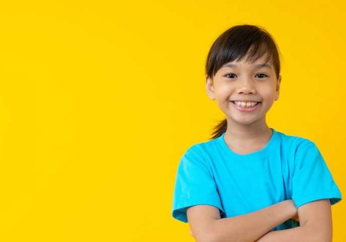 smiling-girl-yellow-background